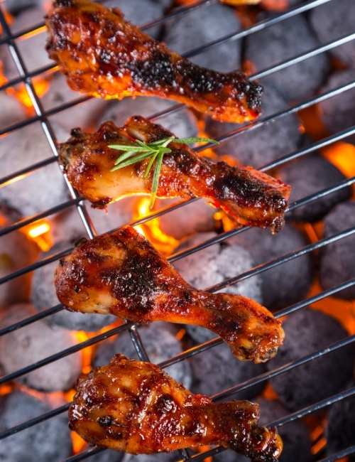 A close-up of a grilled Indian dish, such as Tandoori or Tikka, featuring char-grilled pieces of meat or paneer on a serving platter, typically found at indian restaurants in franklin tn.